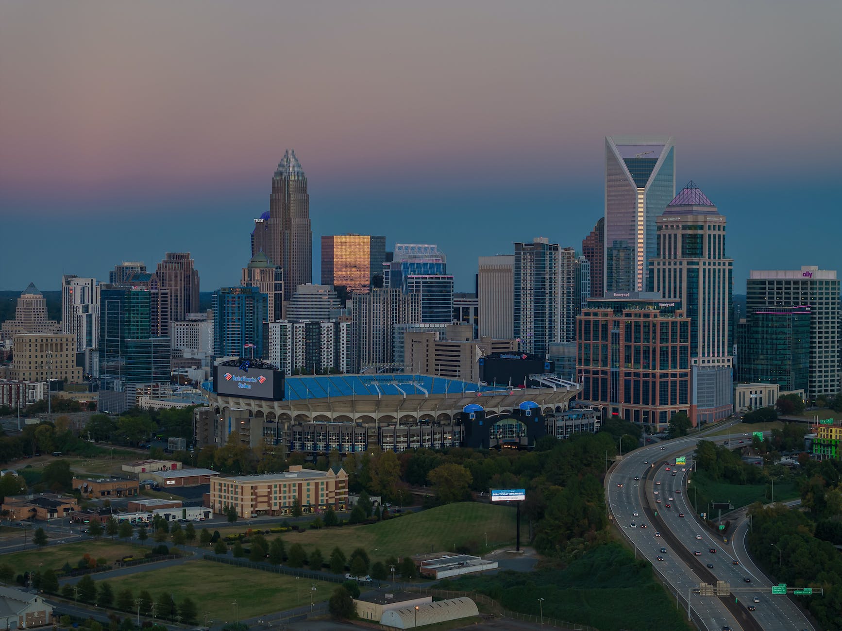 cityscape with skyscrapers and bank of america stadium in charlotte north carolina usa