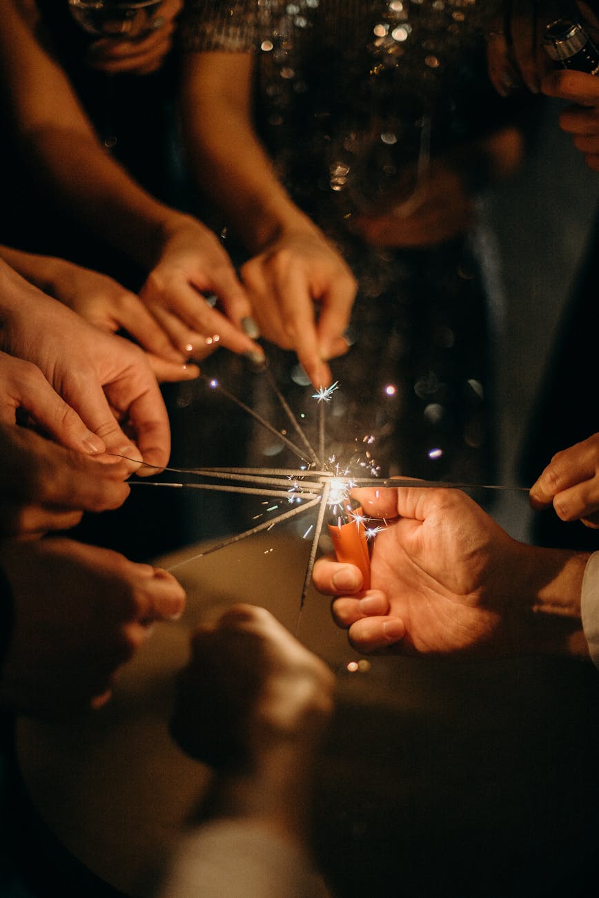 people lighting sparklers